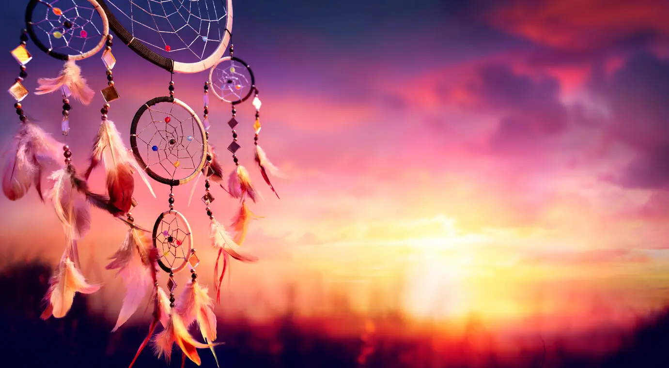 Dreamcatcher at a pink and purple sunset