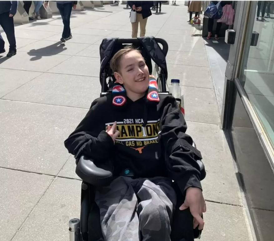 Maclain Agnew, young boy with cerebral palsy and mobility issues, in a wheelchair, in New York City