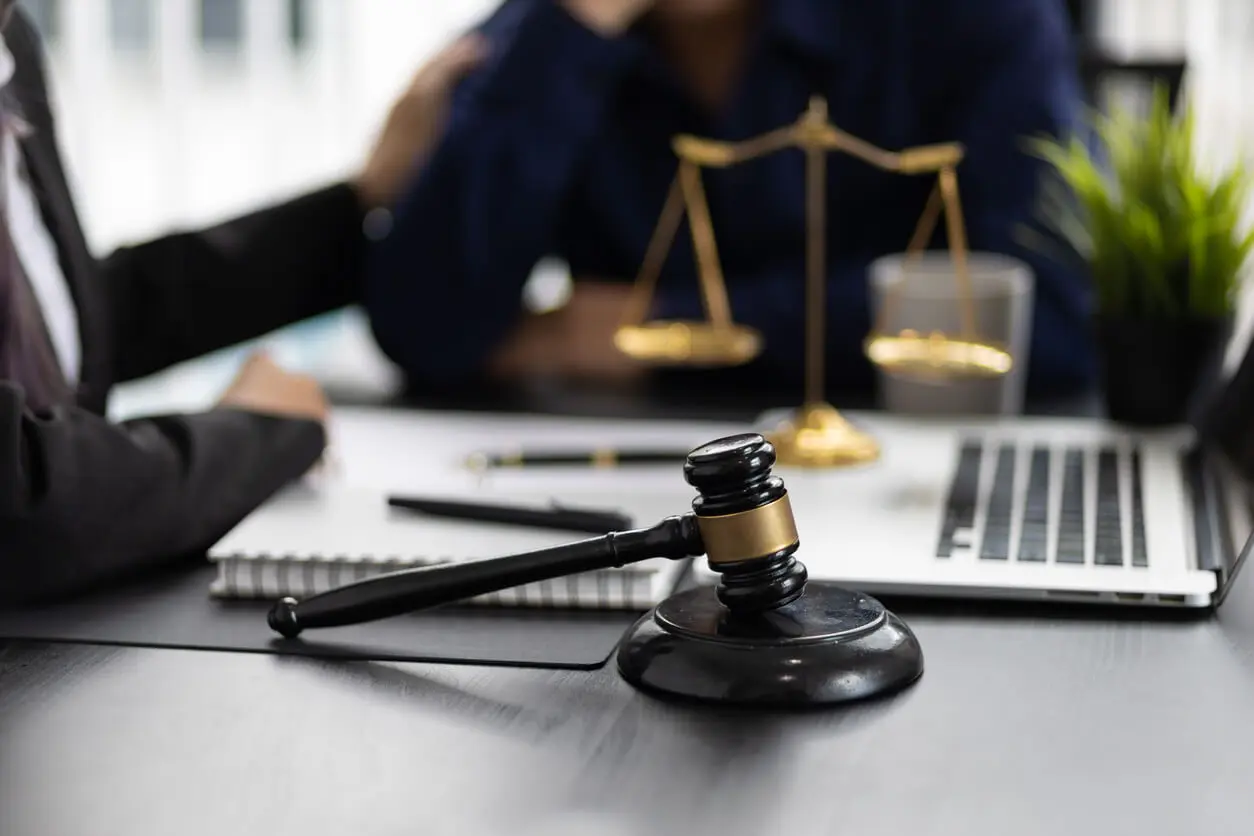 a lawyer discusses a client's legal options with them