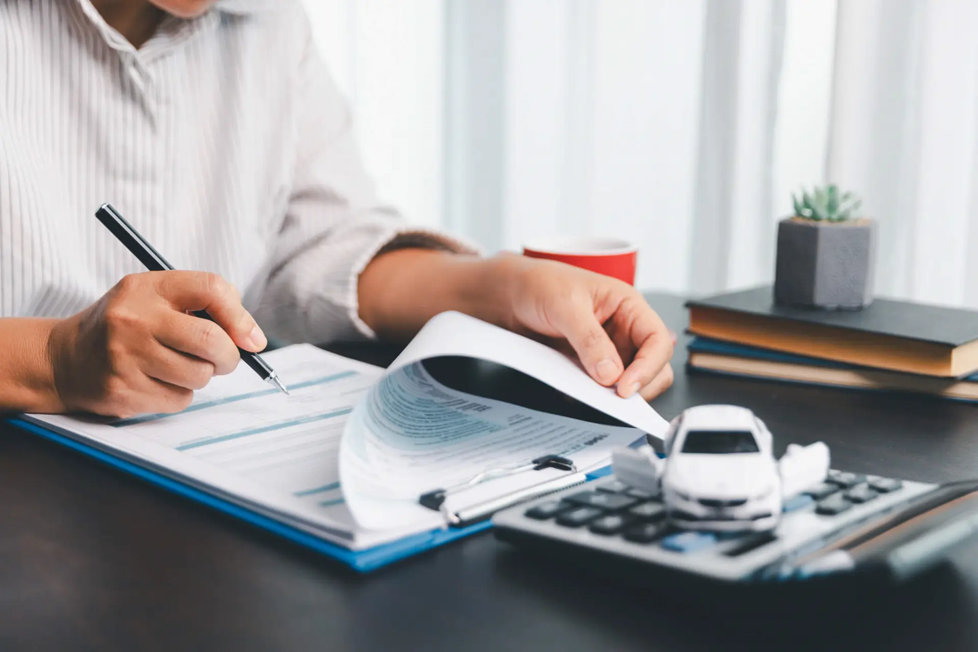 a person reviews their Ontario auto insurance policy after the changes to the system are put in place
