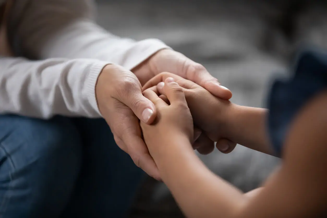 childhood sexual abuse survivor being comforted by a sexual abuse lawyer