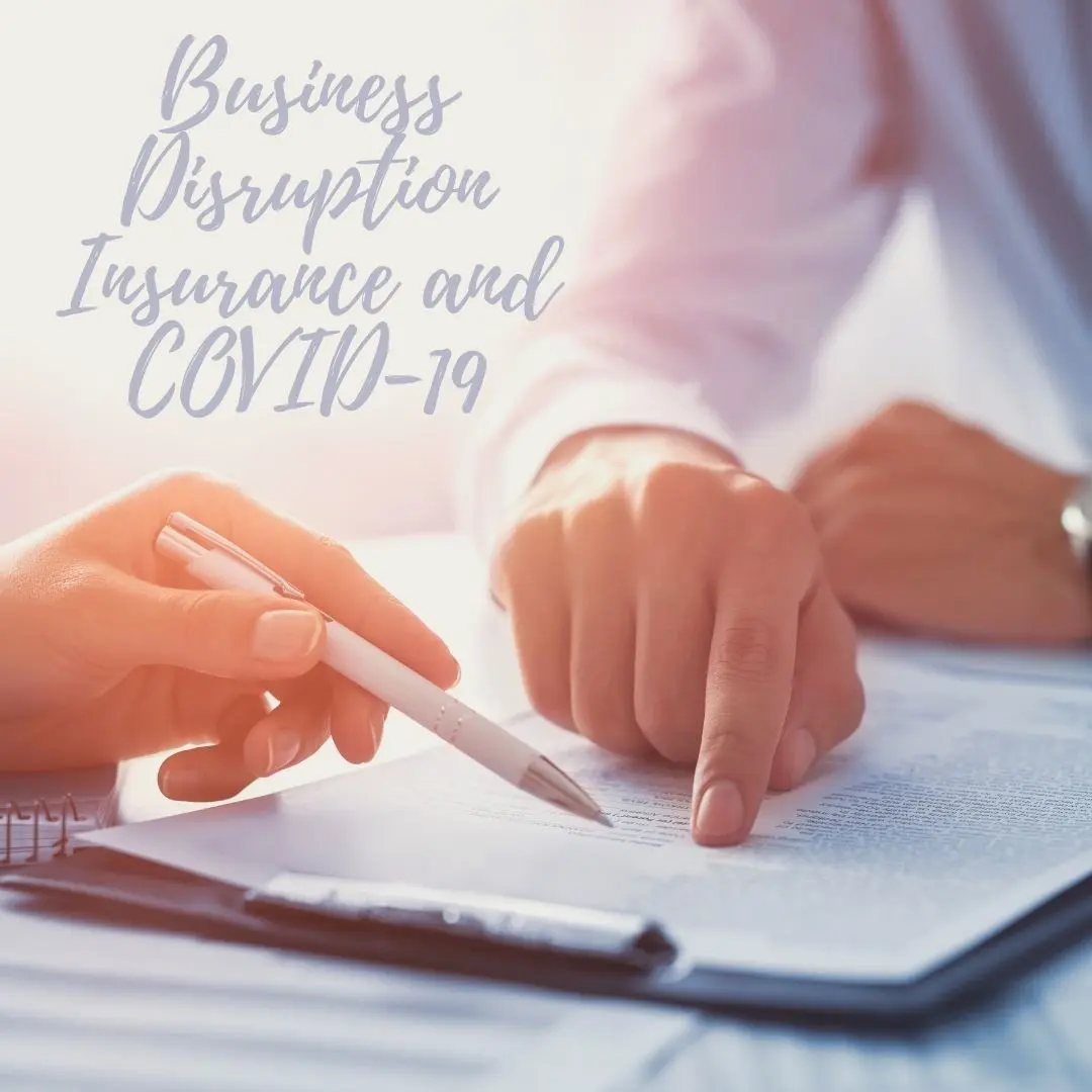 close up of signing insurance documents in the office with a caption that says, "Business Disruption Insurance & COVID-19"