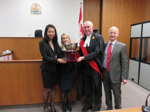 Derek Nicholson and the Honourable Justice Thomas Carey present the 2016 OTLA Cup to the winning team