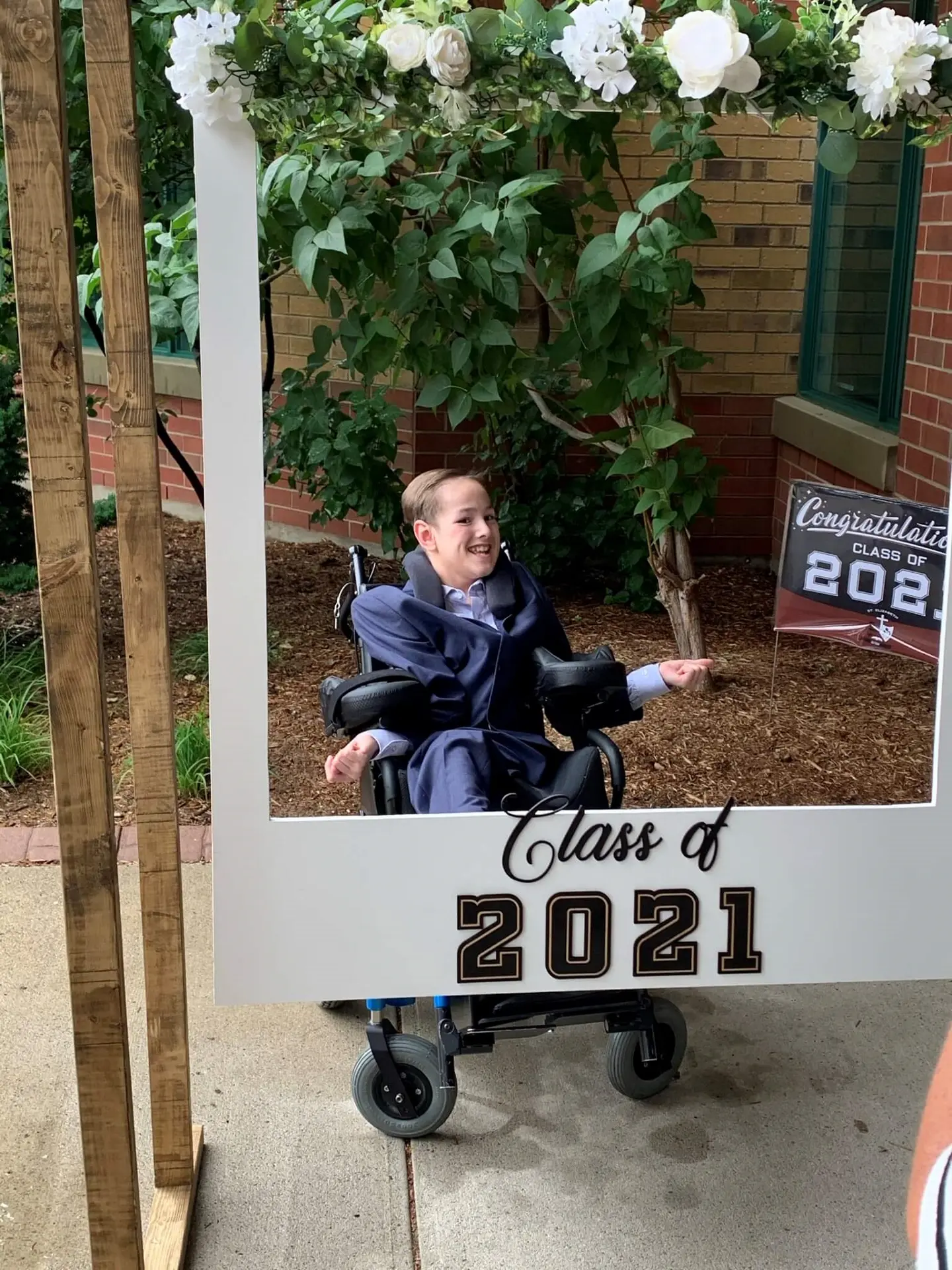 Young boy in wheelchair,. Graduating Class of 2021